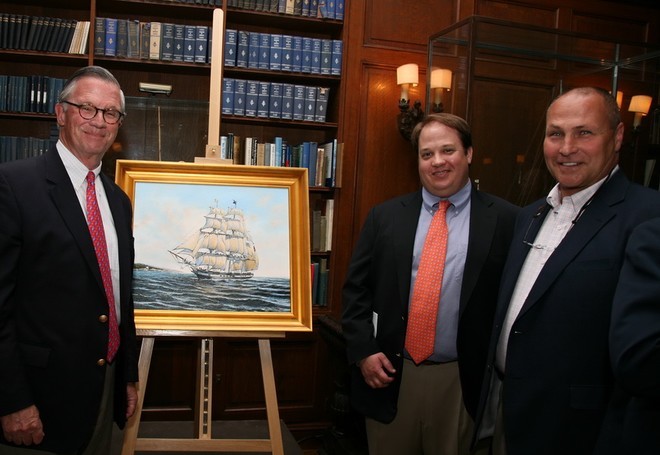 C.R. Perry Rodgers, Jr. (left), a descendent of Oliver Hazard Perry, placed the highest bid on an original oil painting of the Tall Ship Oliver Hazard Perry, as it will look when completed.  The Newport artist Walter Scott (right) and Rodgers’ son, C.R. Perry Rogers III,  stand nearby. Photo: Mark Dobrow © SW